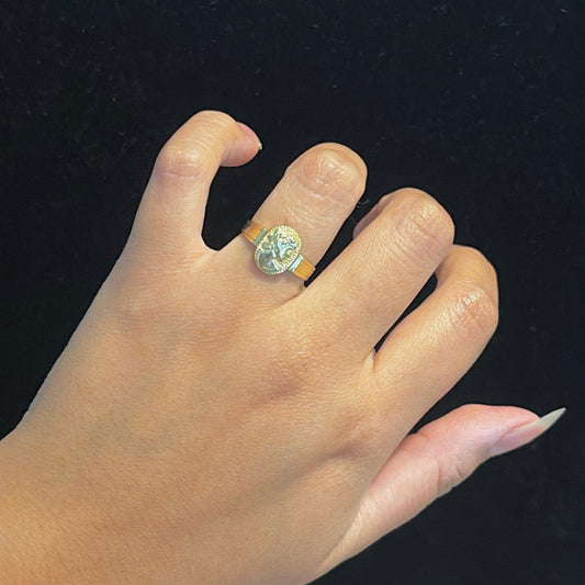 14k Gold Roman-Inspired Coin Ring on hand for reference