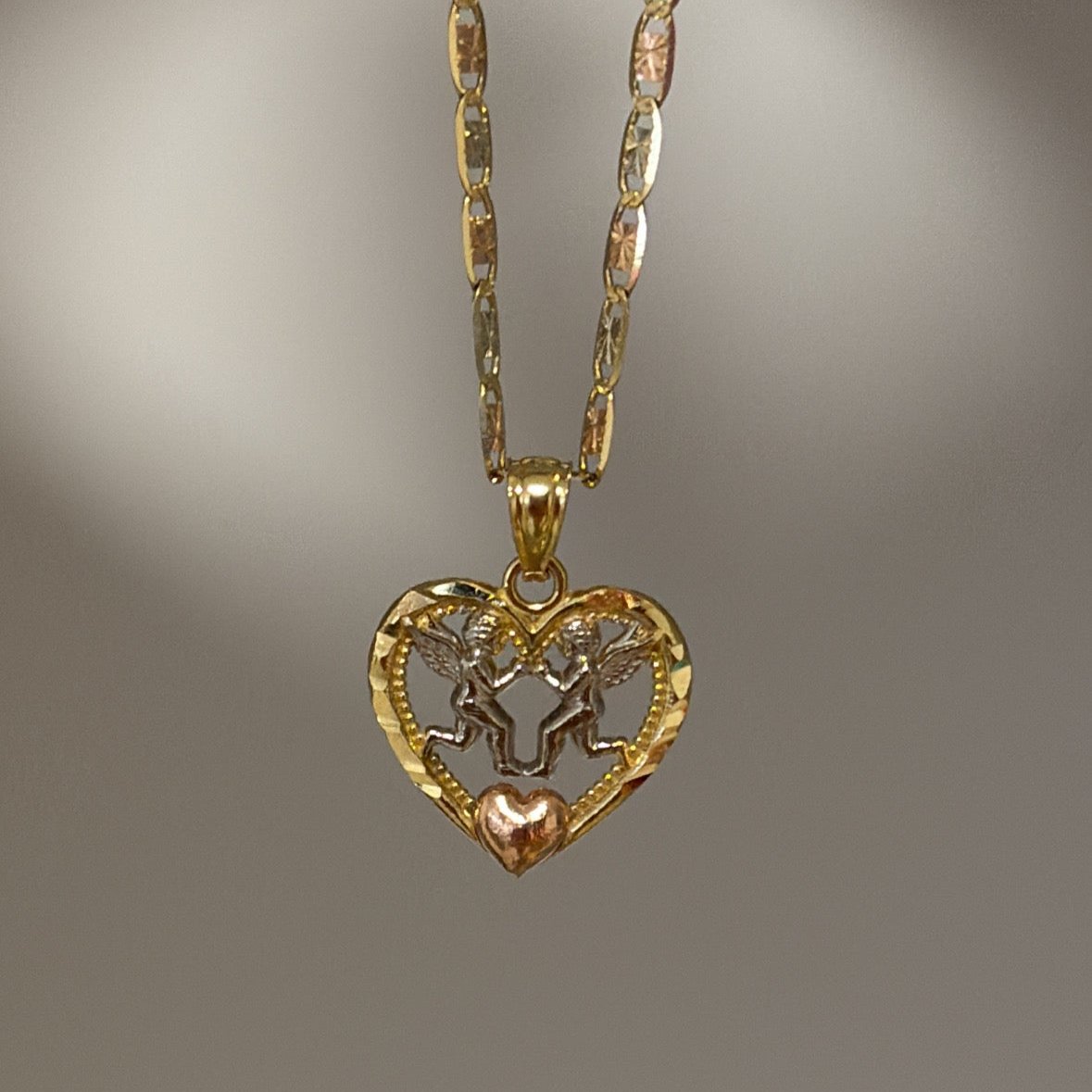 solid gold two angel in a heart charm
