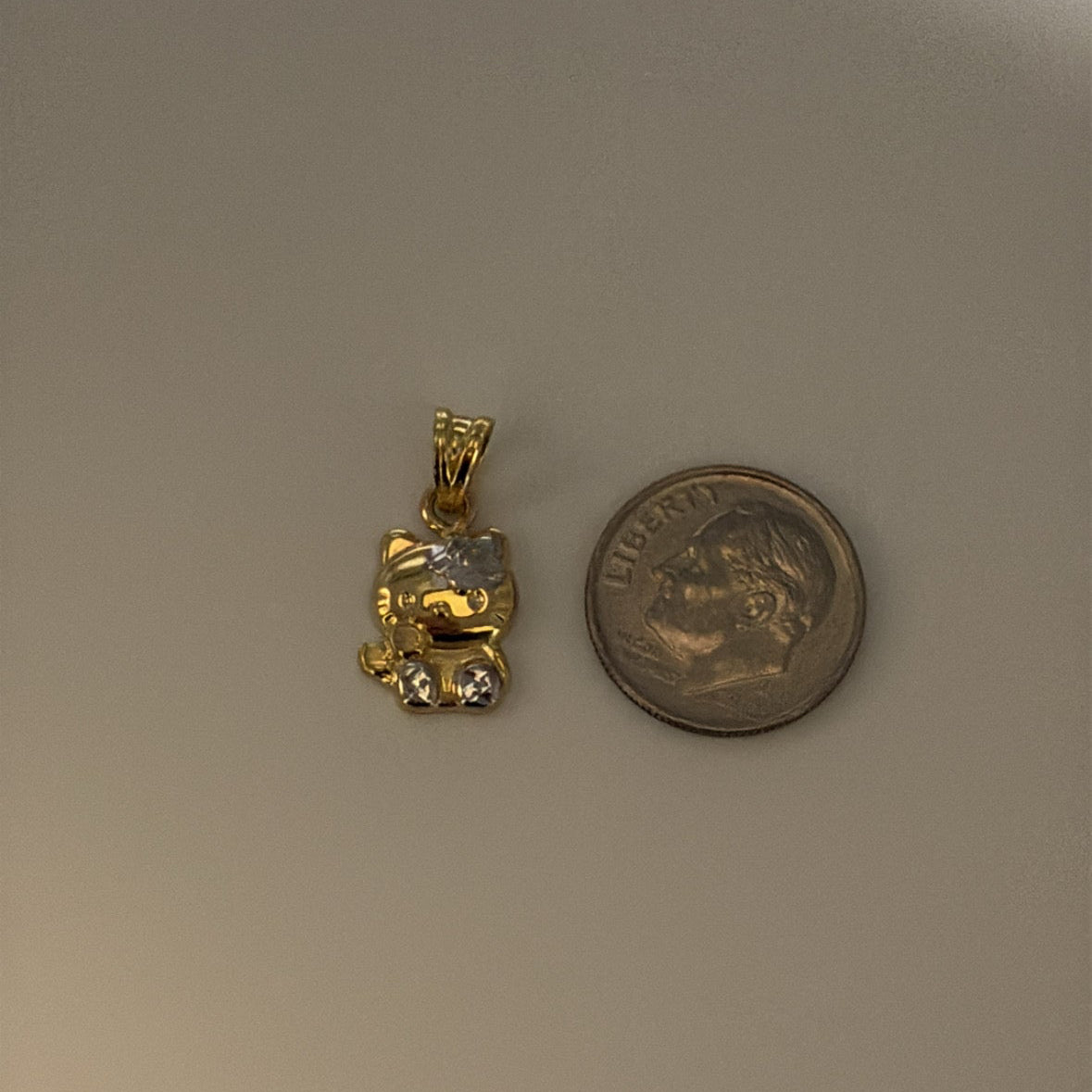 14k and 10k hello kitty-inspired charm