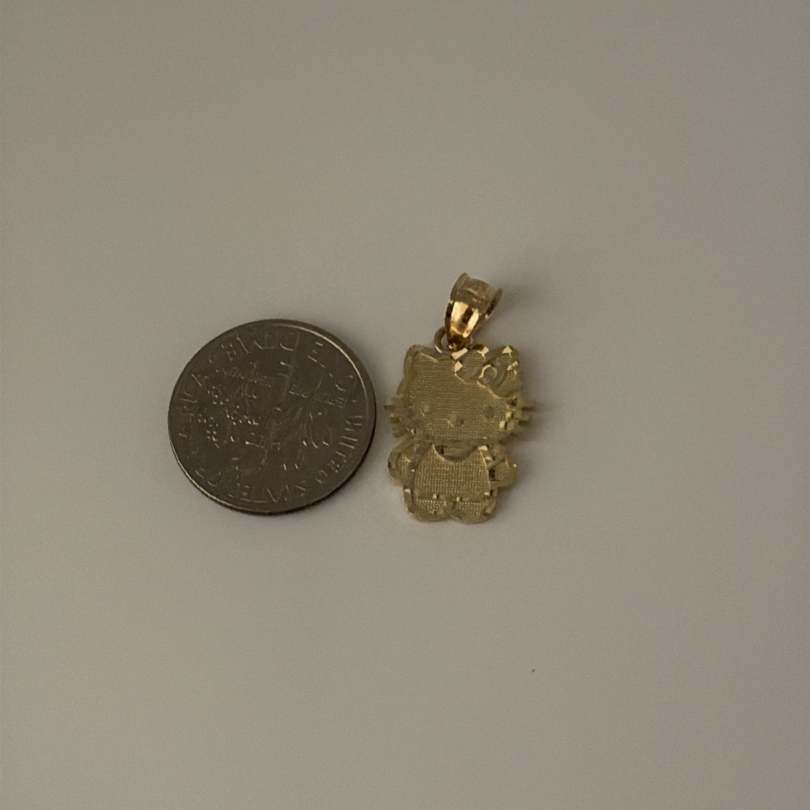 14k and 10k hello kitty-inspired charm