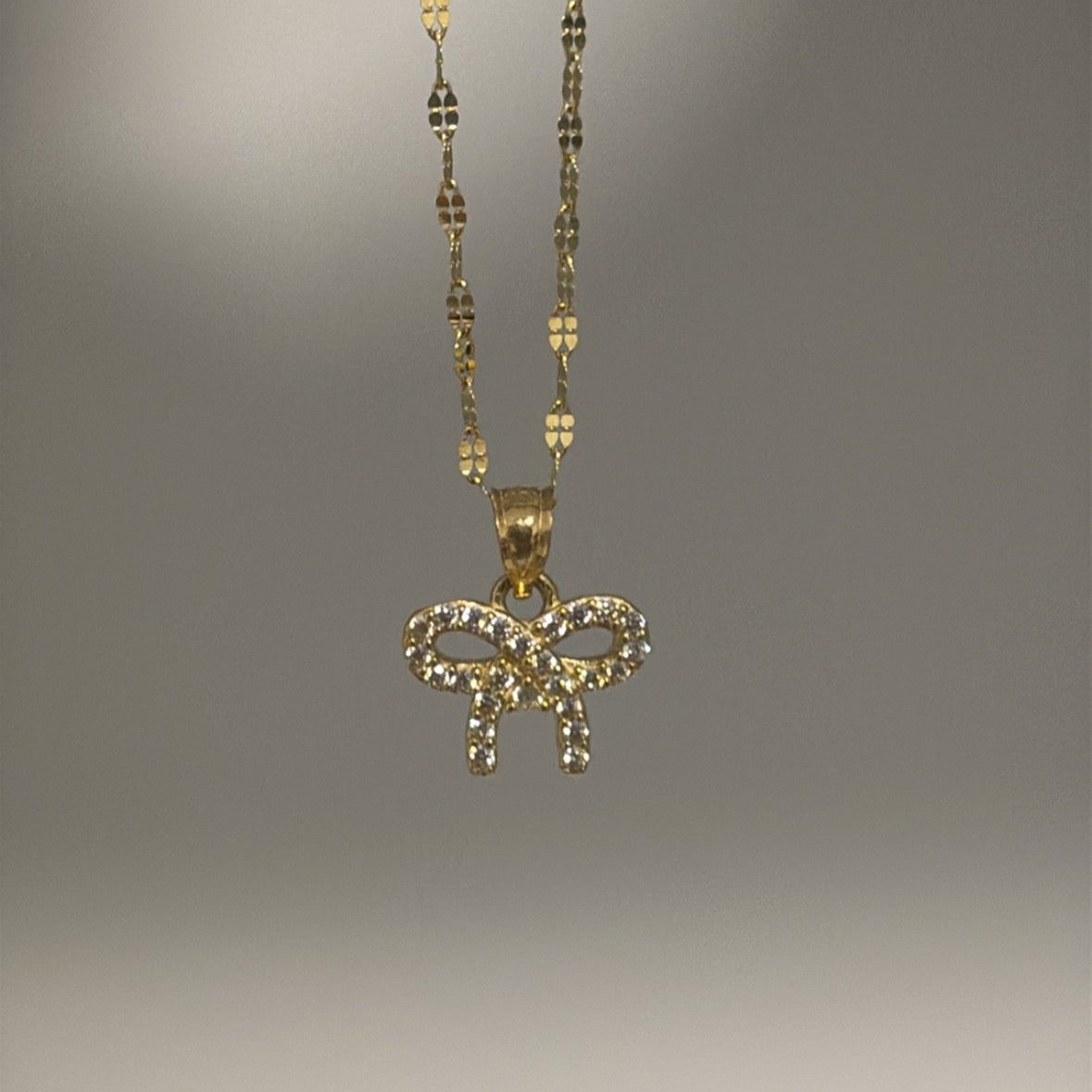solid gold bow charm