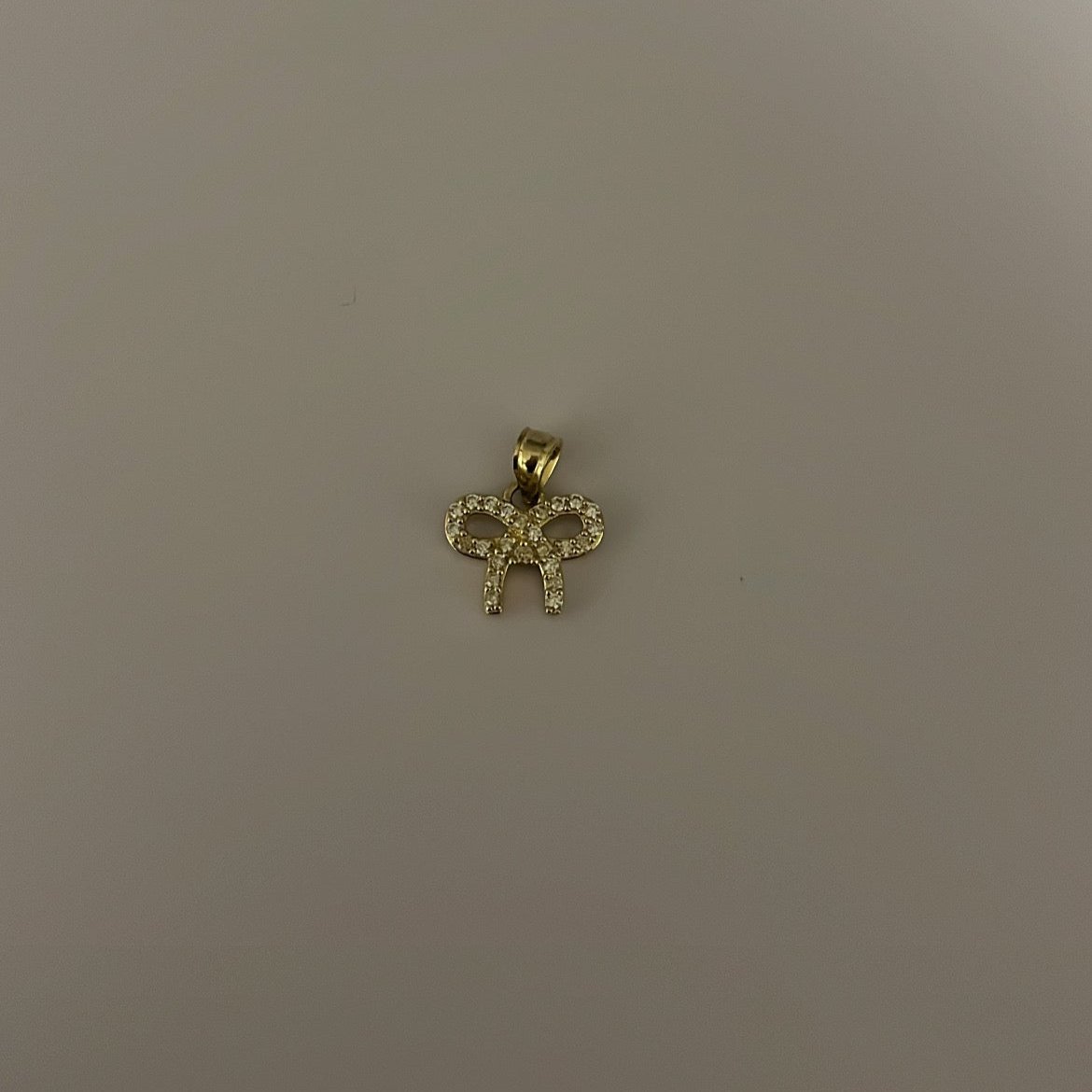 solid gold bow charm