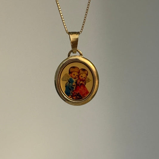 Vintage Italian 14K gold pendant featuring two angels embracing, Italy 585.