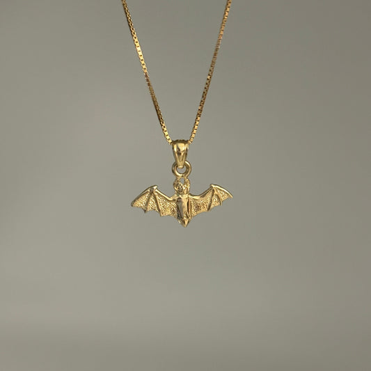 14K gold bat charm pendant with outstretched wings on chain