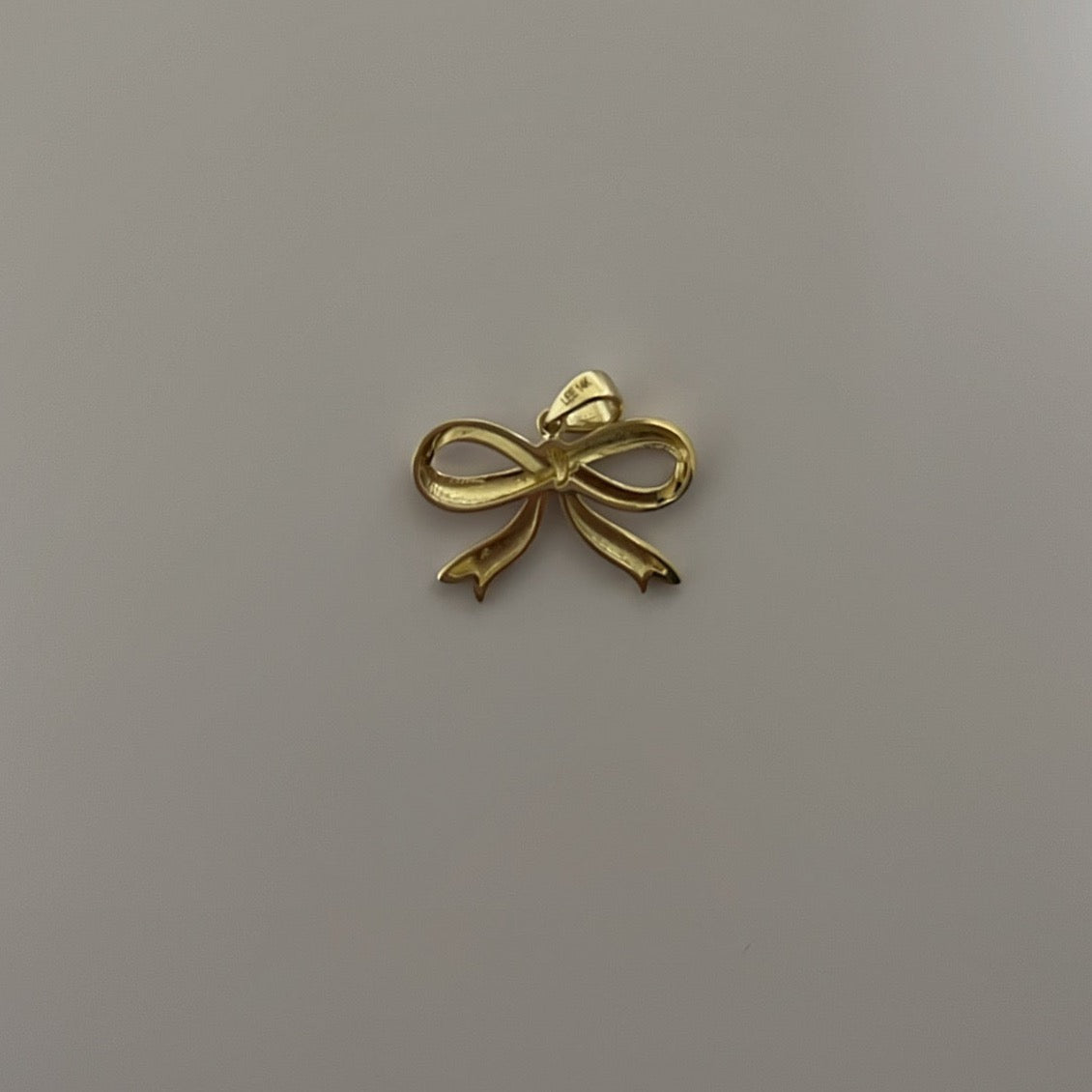 14K yellow solid gold bow charm