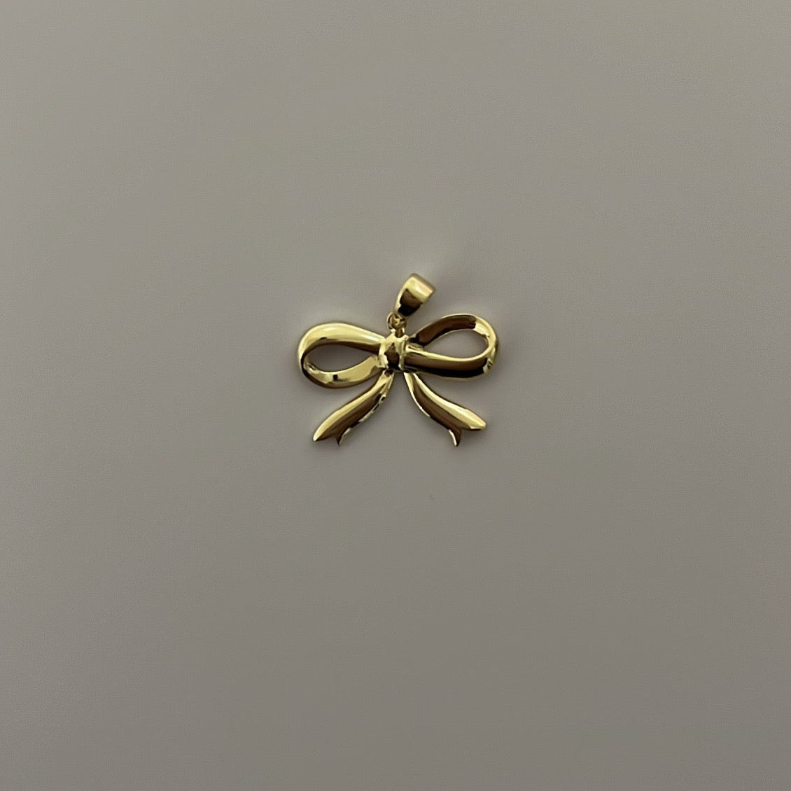 14K yellow solid gold bow charm