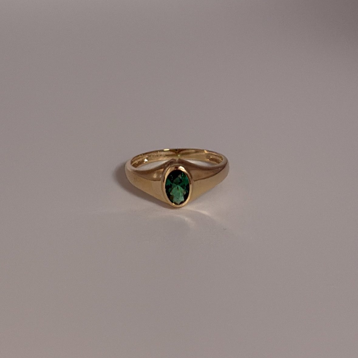 14K solid ring with green CZ