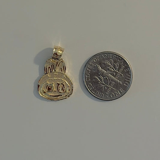 Gold pendant and silver coin on a gray background