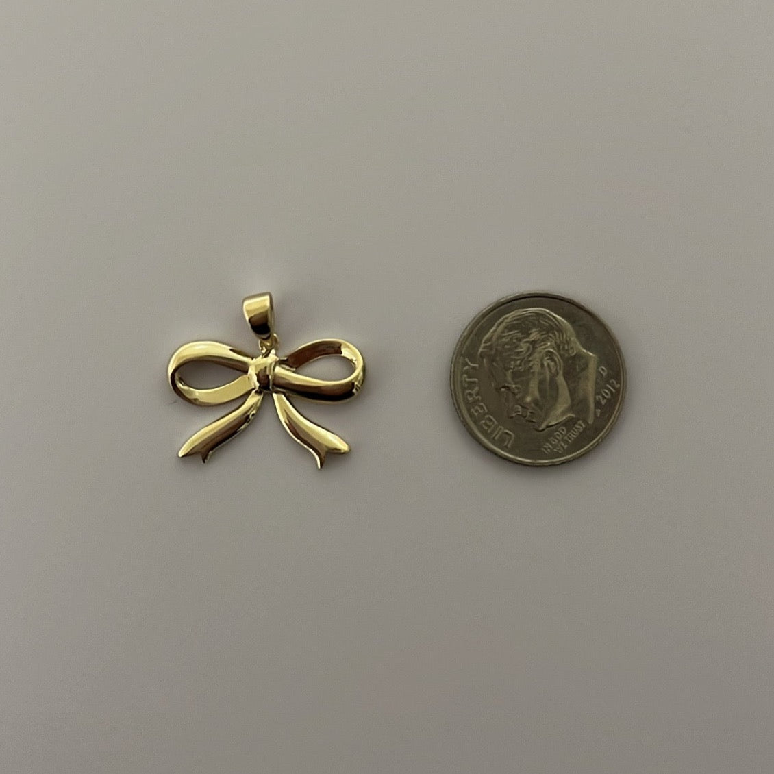 14K yellow solid gold bow charm