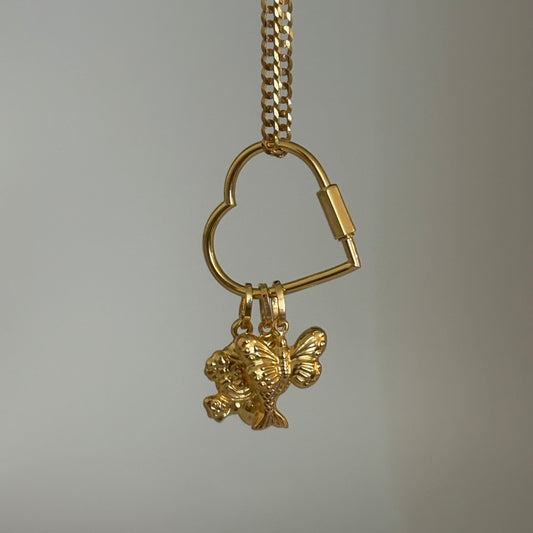14k Gold keychain with a heart-shaped key and puffy charm on a gray background