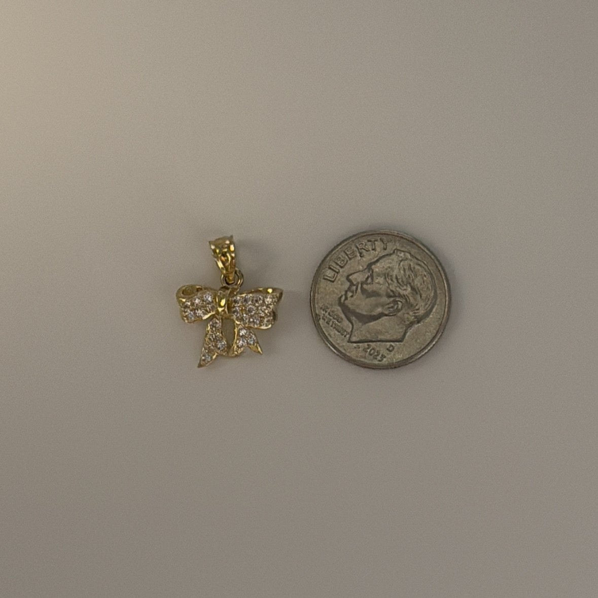 10K  gold CZ bow charm