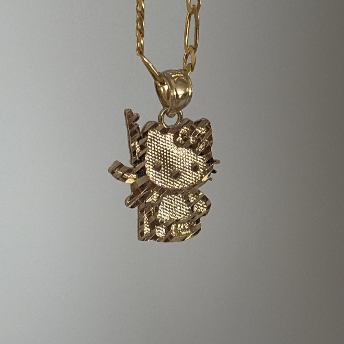 14k and 10k hello kitty-inspired charm