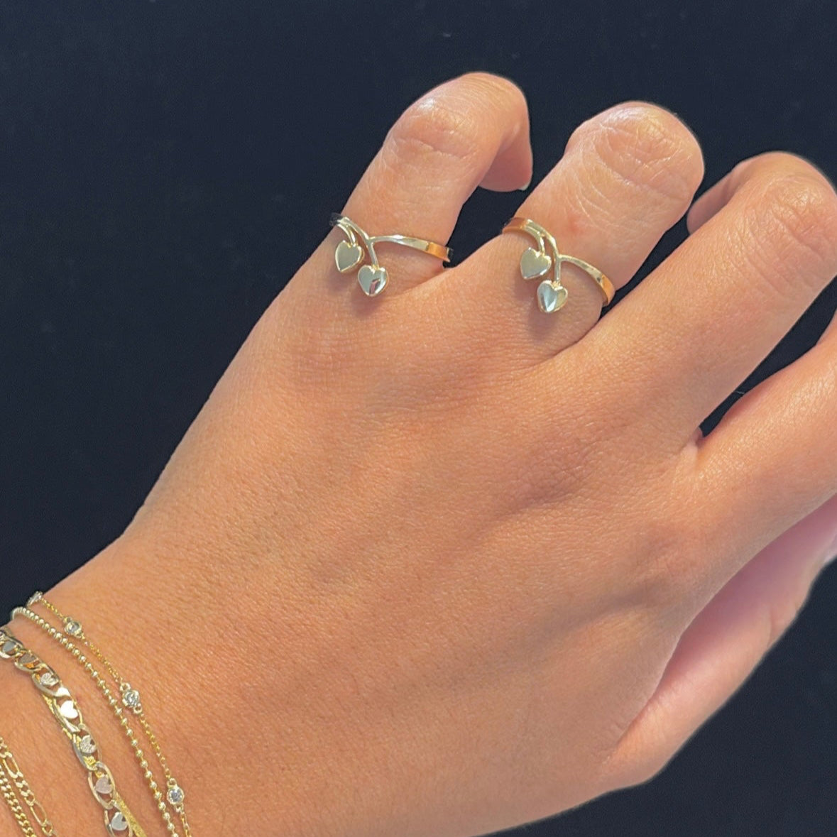  14k gold cherry heart ring on hand for reference