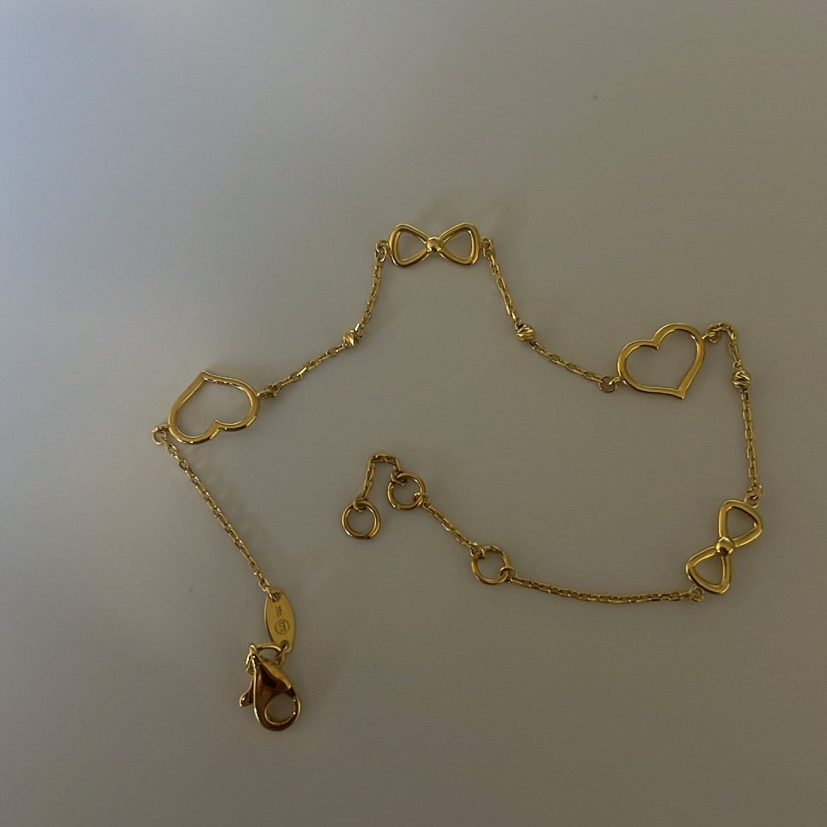 10k solid gold bow and hearts bracelet