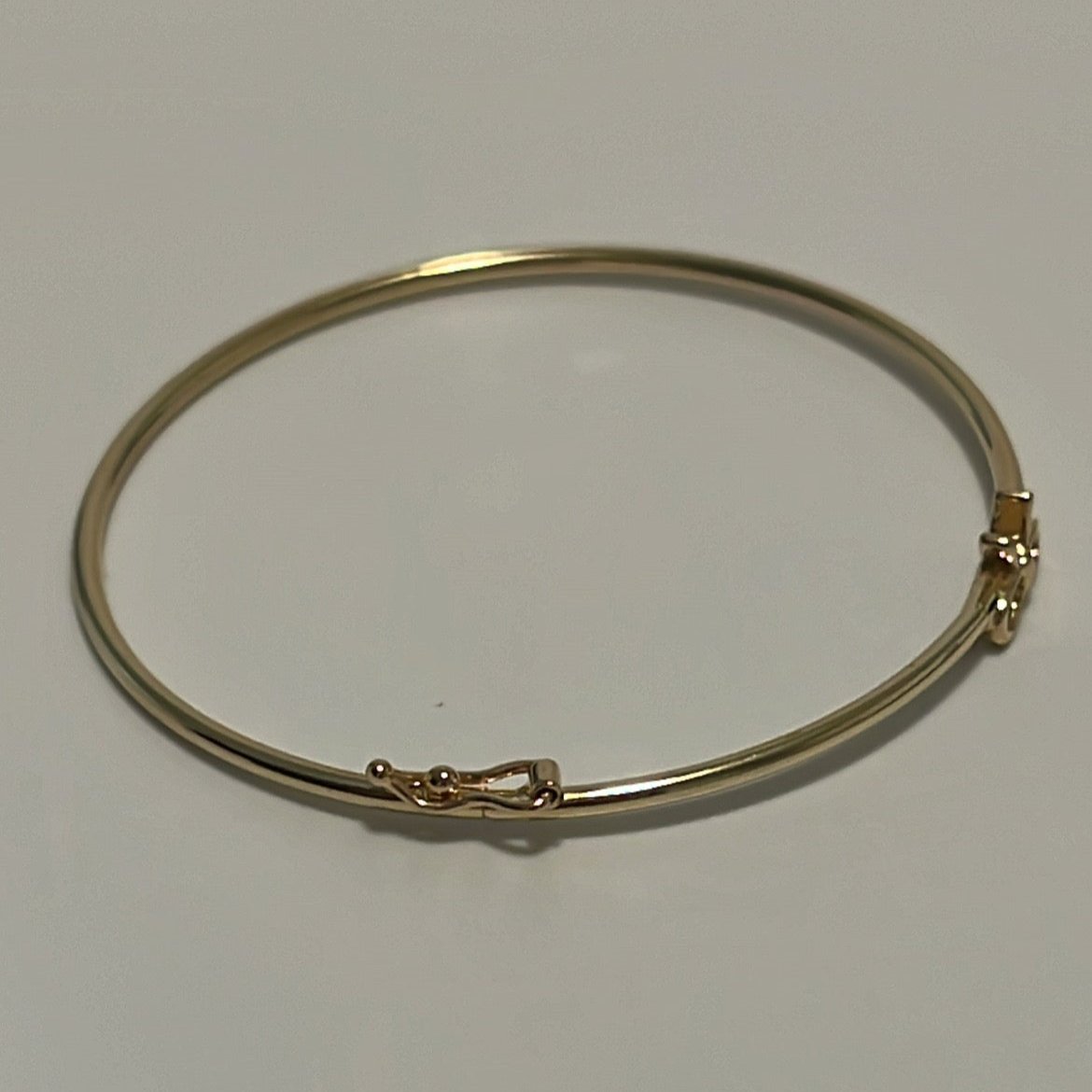 14k Baby bangle with a cute bow